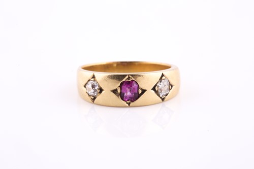 Lot 276 - An 18ct yellow gold, diamond, and ruby ring,...
