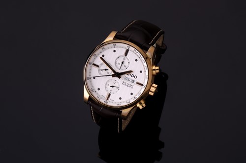 Lot 414 - A Mido Multifort gold plated stainless steel...