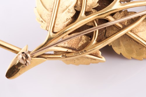Lot 10 - An 18ct yellow gold floral spray brooch, in...
