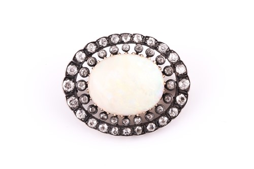 Lot 325 - A diamond and opal brooch, of oval design,...