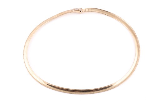 Lot 31 - A 9ct yellow gold flat-link bib-style necklace,...