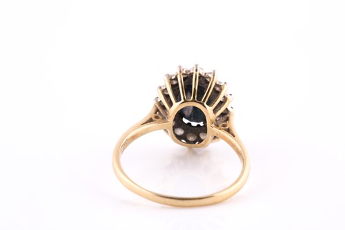 Lot 43 - An 18ct yellow gold, diamond, and sapphire...