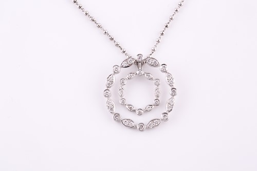 Lot 295 - An 18ct white gold and diamond double wreath...