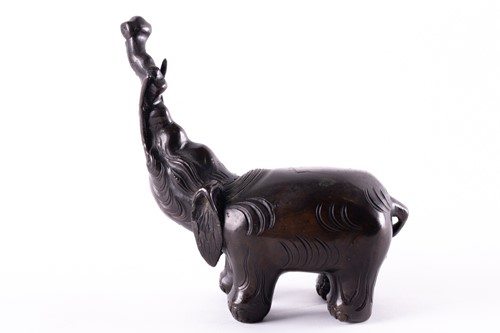 Lot 112 - A Chinese patinated bronze elephant figure of...