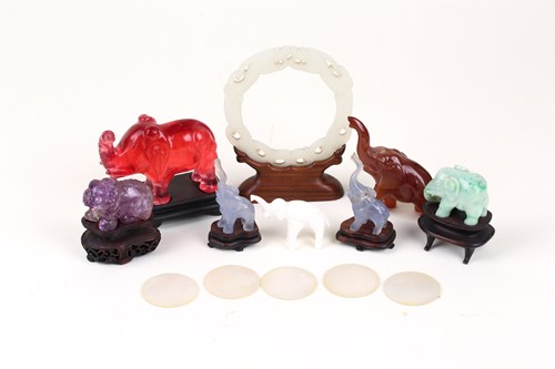 Lot 163 - A Chinese Jade amulet, carved and pierced with...