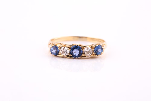Lot 417 - A sapphire and diamond five stone half hoop...