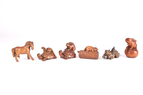 Lot 79 - A group of six Japanese hardwood carved...