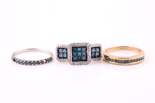 Lot 447 - Three blue diamond-set rings Each set with...