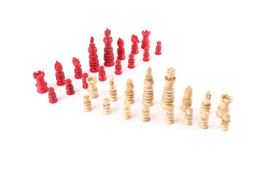 Lot 271 - A late 19th century stained ivory chess set,...