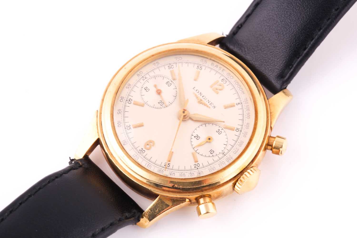 Lot 739 - A gentleman's 18k yellow gold Longines Flyback...