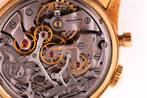 Lot 739 - A gentleman's 18k yellow gold Longines Flyback...