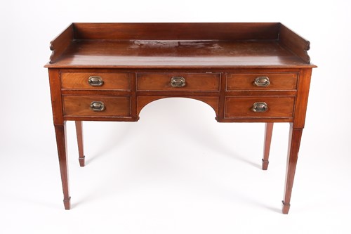 Lot 136 - A George III mahogany gallery backed kneehole...