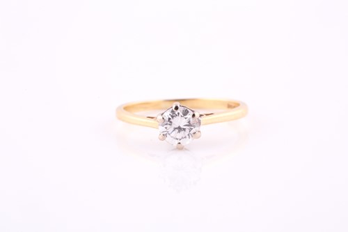 Lot 653 - A single stone diamond ring. The round...