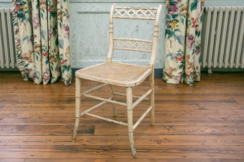 Lot 109 - A Regency painted faux bamboo soiree chair...