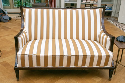 Lot 118 - A contemporary curved backed mahogany two...