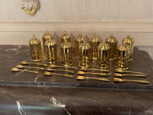 Lot 131 - A set of twelve silver gilt pepperettes by...