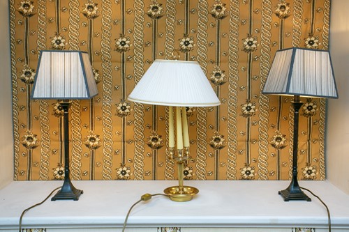 Lot 29 - A pair of decorative painted metal classical...