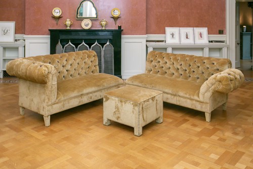 Lot 3 - A two section deep button upholstered...