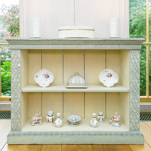 Lot 7 - A Chinese Chippendale style painted and...