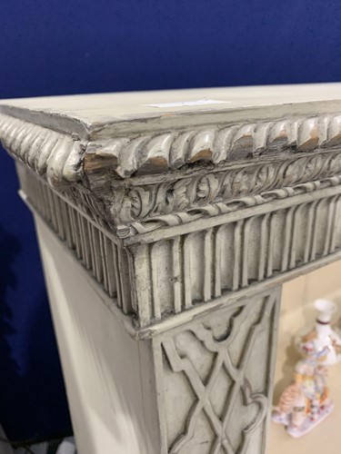 Lot 7 - A Chinese Chippendale style painted and...