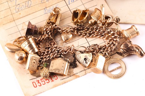 Lot 331 - A 9ct gold charm bracelet,the 9ct yellow gold...