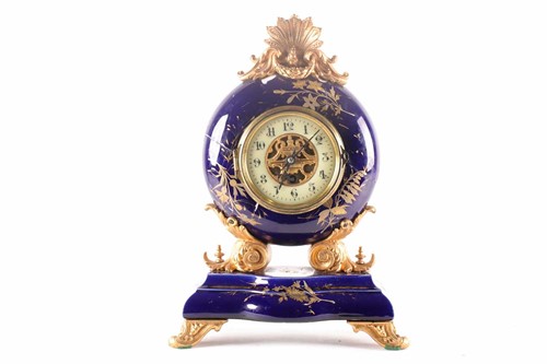 Lot 214 - A French gilt spelter and porcelain mantel...