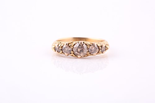 Lot 435 - A five-stone diamond ring Set to the front...