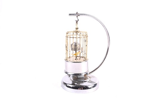 Lot 244 - A mid-20th century automaton clock, a bird in...