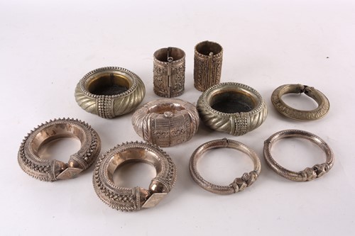 Lot 182 - A Persian white metal slave bangle, with...