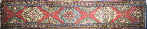 Lot 129 - A 20th-century red ground Turkish carpet...