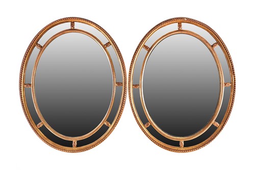 Lot 131 - A pair of George III Adam style gilt framed...