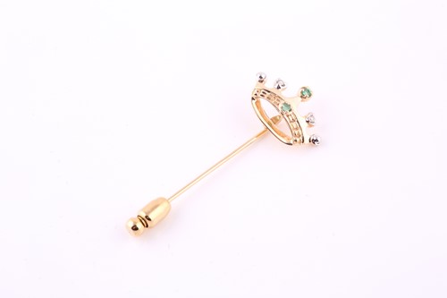Lot 386 - A crown tie pin, set with diamonds and...