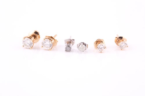 Lot 364 - Three pairs of diamond ear studs, the largest...