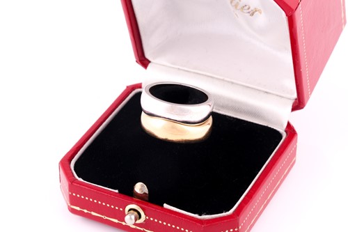 Lot 166 - A Cartier 'Love Me' set of two band rings, one...