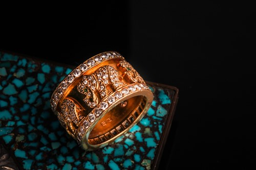 Lot 232 - A Cartier 'Elephant' ring, the wide band...