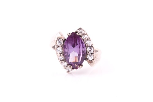 Lot 88 - A blue and purple central stone and white...