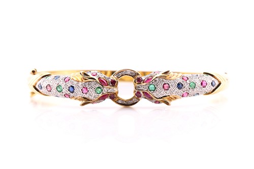 Lot 83 - A Cartier-style panther bangle, the panther...