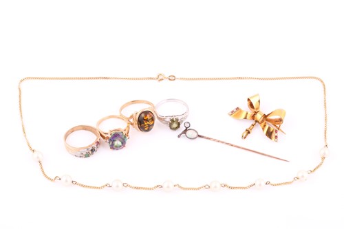 Lot 161 - A 9ct gold bow brooch set with seed pearls and...