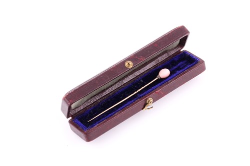 Lot 24 - A conch pearl stick pin, the pink conch pearl...