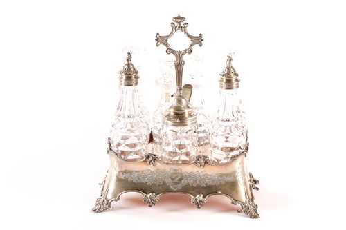 Lot 378 - A Victorian silver seven bottle table cruet...