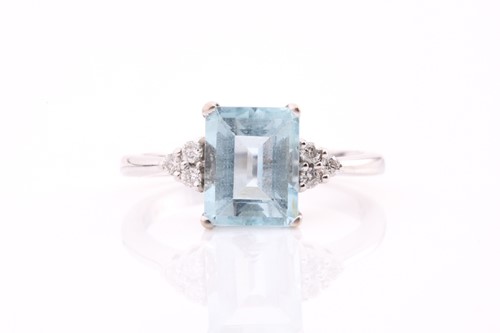 Lot 230 - An 18ct gold aquamarine and diamond ring, with...