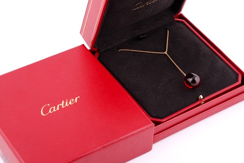 Lot 74 - A Baccarat red crystal egg pendant necklace,...