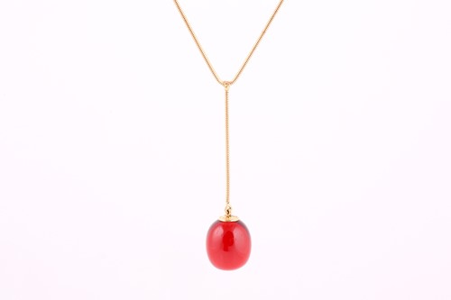 Lot 74 - A Baccarat red crystal egg pendant necklace,...