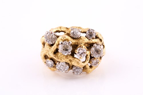 Lot 86 - A diamond cocktail ring set in yellow metal,...