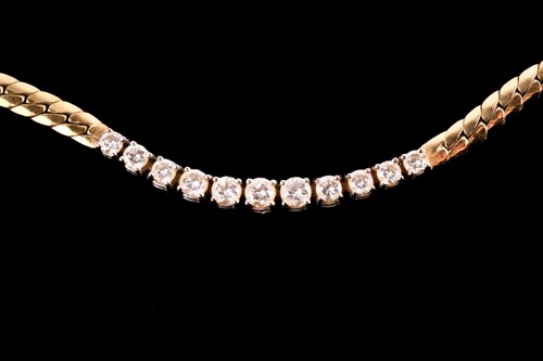 Lot 25 - A flat snake chain necklace set with eleven...