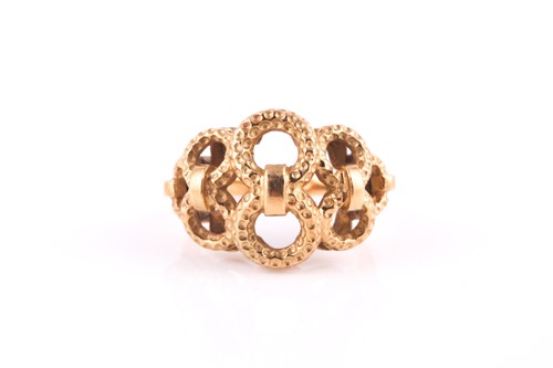 Lot 133 - A yellow precious metal ring, 1970s, graduated...