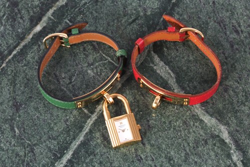 Lot 187 - A Hermes ladies Kelly padlock watch, the two...