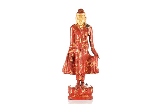 Lot 98 - A Burmese carved wood and cinnabar lacquered...