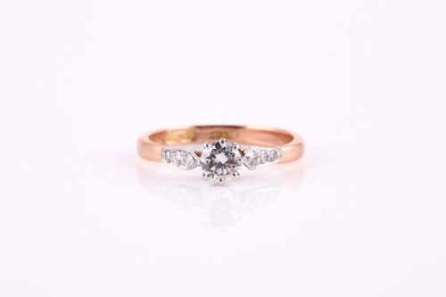 Lot 21 - A single stone diamond ring, the round...