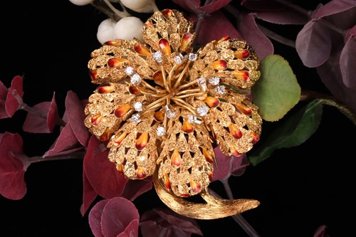 Lot 202 - A diamond and enamel flower head brooch, set...